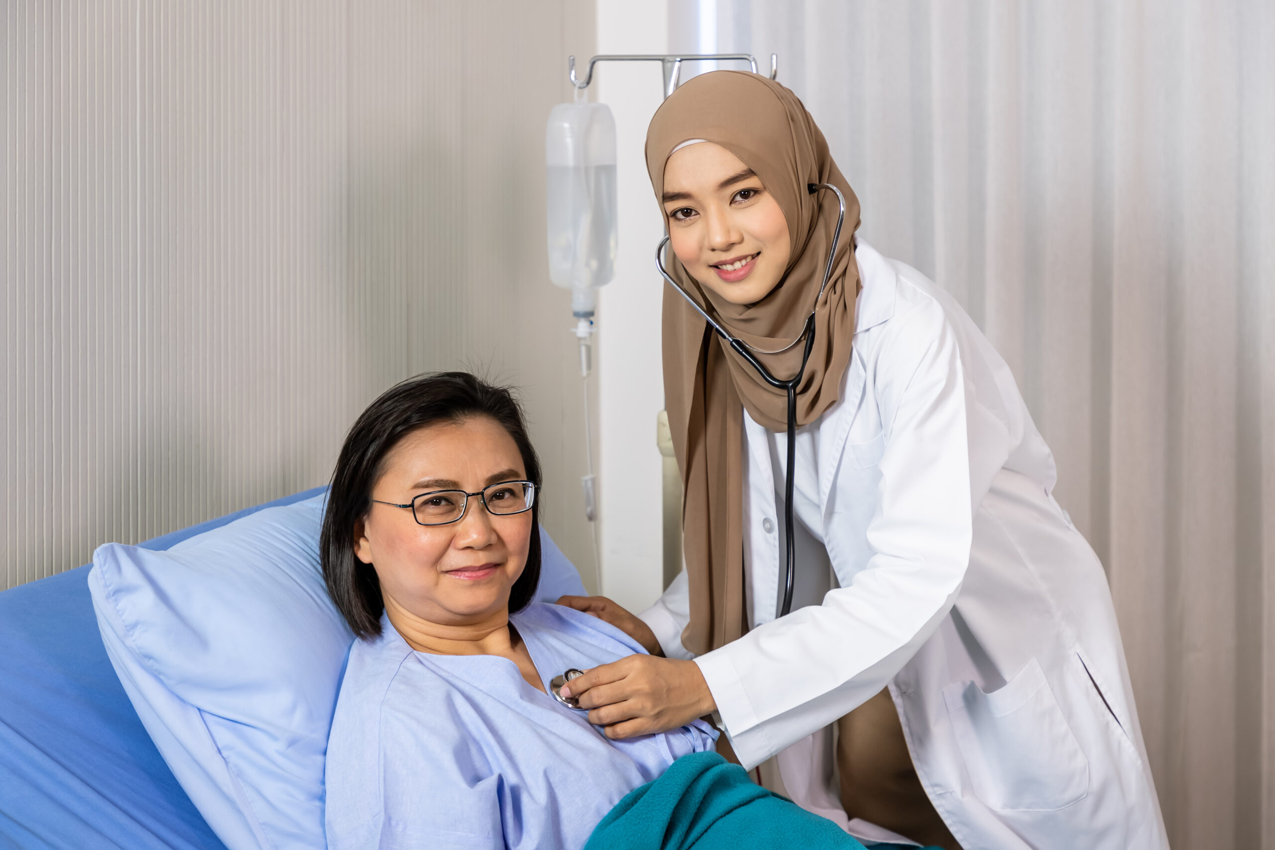 Muslim female woman medical doctor using stethoscope